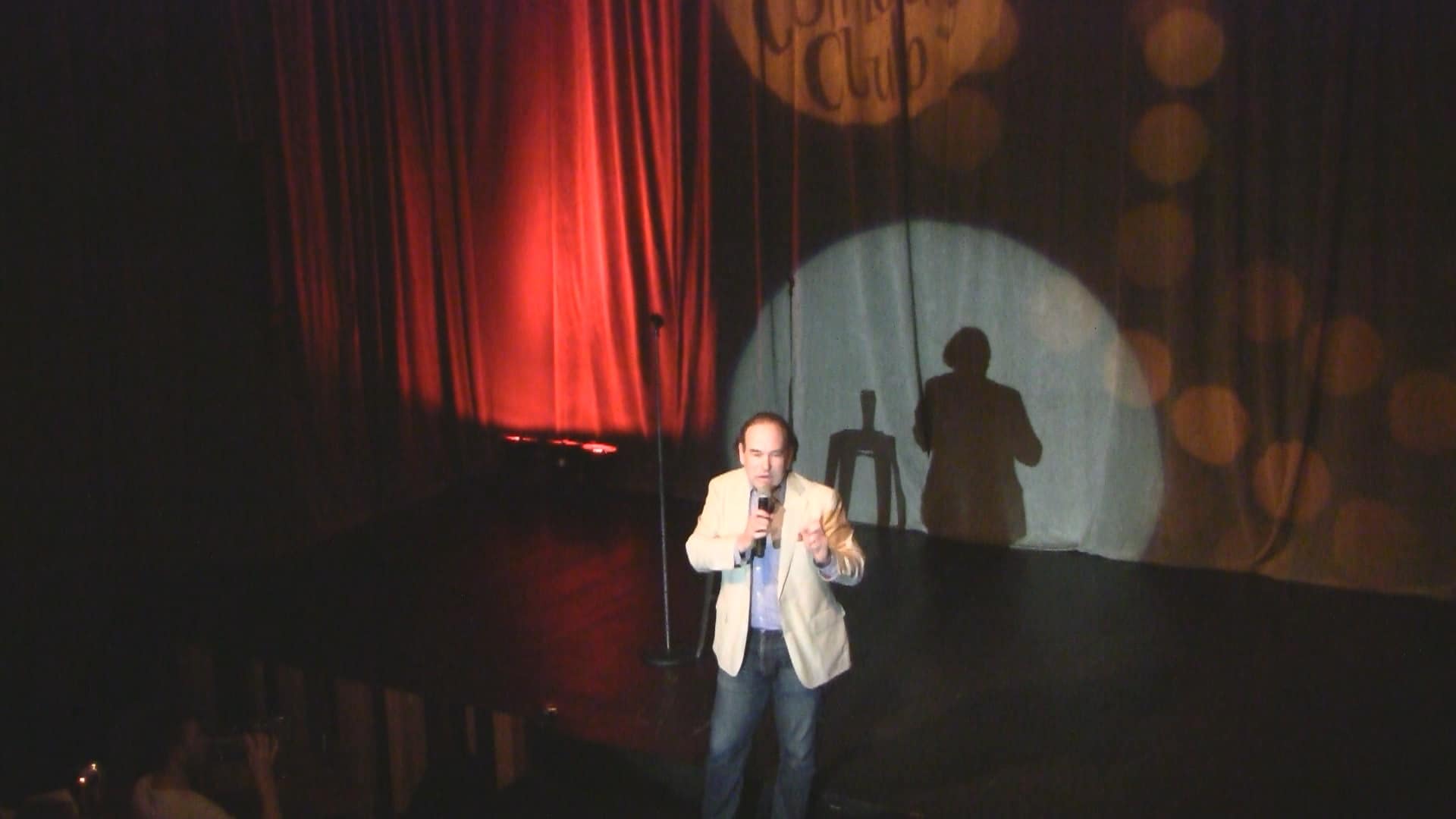 American clean corporate stand-up comedian Shaun Eli on stage at South Africa's Cape Town Comedy Club