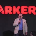 American comedian Shaun Eli on stage at Parker's Comedy Club in Johannesburg, smiling down at the audience