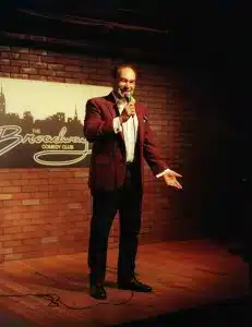 Shaun Eli on stage at Broadway Comedy Club